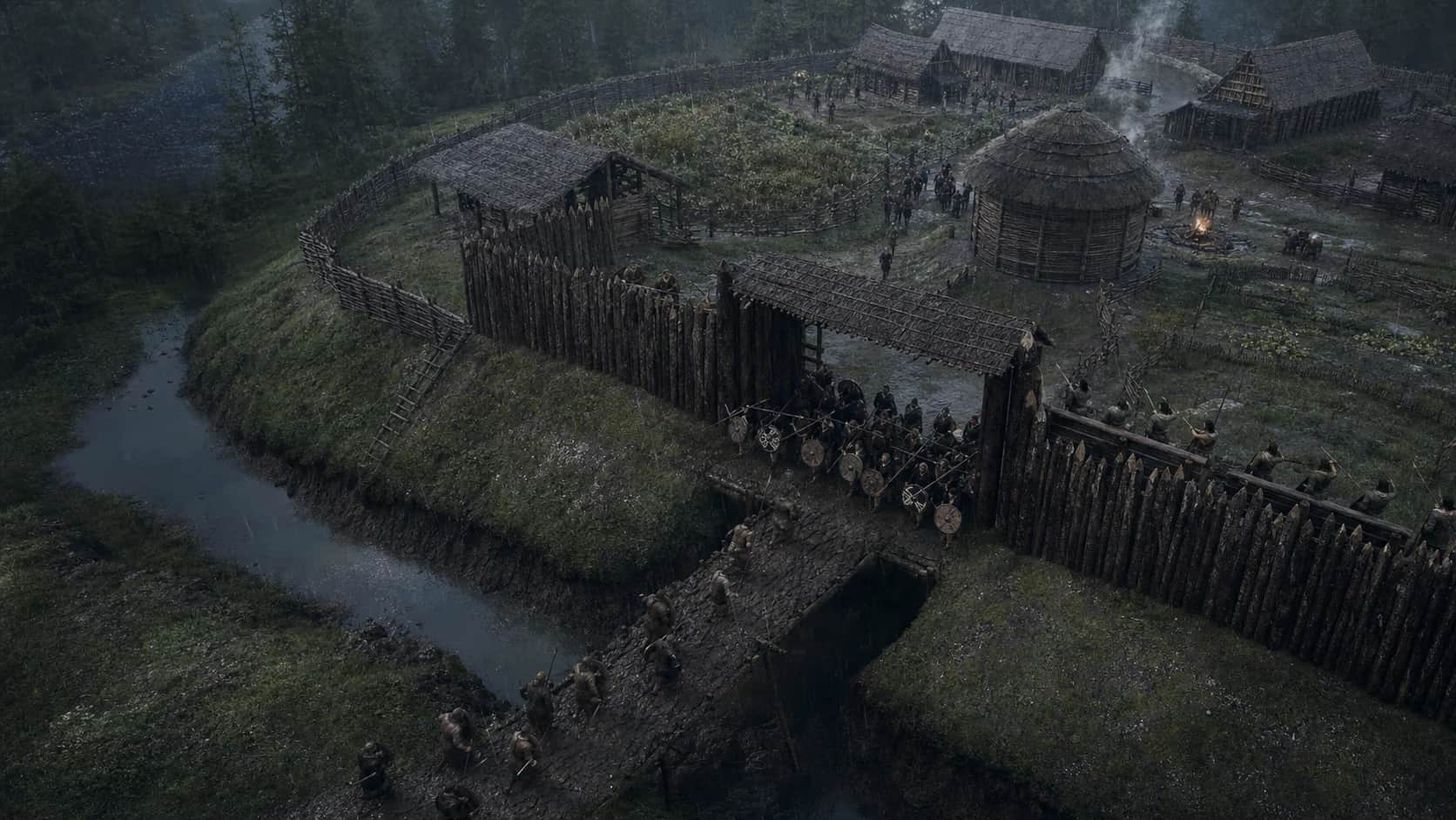 A village shield line commits at a wet gate while attackers cross the ditch